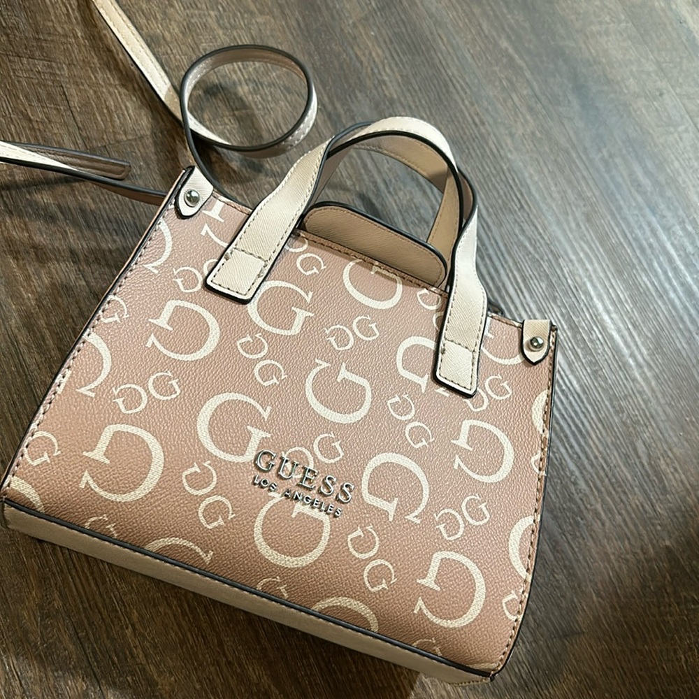 Supper cute GUESS purse with long strap or carry by the little handles